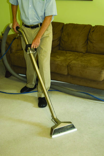 Louisville Mold Cleanup hot water extraction wand in action on carpet